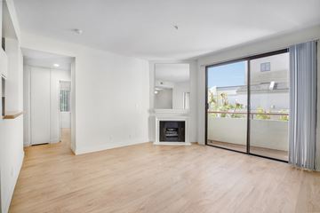 Los Angeles apartment for rent - a living room with a fireplace and a sliding glass door