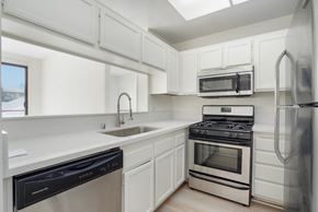 Los Angeles apartment for rent - kitchen with stainless steel appliances, white counter tops and cabinets. at Ashton Towers, Los Angeles, 90024