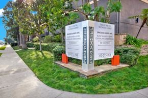 Los Angeles apartment for rent - A sign in front of a building advertises a spacious luxury apartment at Twelve One Ten Rochester, Los Angeles, 90025
