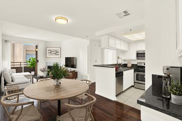 Los Angeles apartment for rent - A modern kitchen with a dining table and chairs.