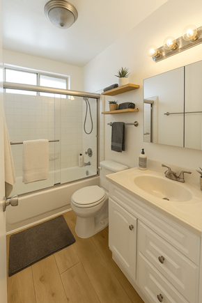 Los Angeles apartment for rent - A white bathroom with a toilet, sink, and shower.