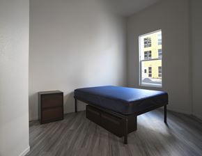 San Ysidro apartment for rent - A bedroom with a bed, nightstand and window.