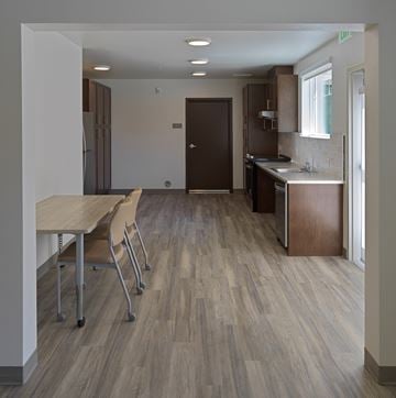 Murrieta apartment for rent - A kitchen with a table and chairs in the foreground.