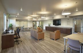 Buena Park apartment for rent - A modern office space with wooden floors and furniture.