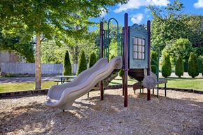 Kent apartment for rent - A playground with a slide and a swing set.