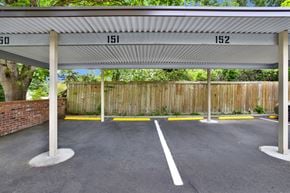 Bellevue apartment for rent - A parking lot with numbered parking spaces 150 to 152.