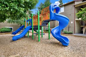 Seattle apartment for rent - A blue and orange slide in a playground.
