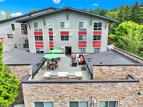 Redmond apartment for rent - A building with a red and white striped wall.