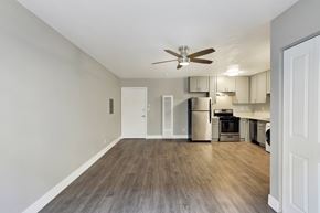Los Angeles apartment for rent - A kitchen with a refrigerator, oven, and microwave.at Federal Apartments, Los Angeles, CA
