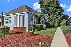 Van Nuys apartment for rent - A small house with a grey front and a red brick base at Sylvan Gardens,Van Nuys,CA