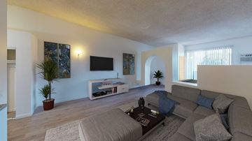 North Hollywood apartment for rent - a living room with a couch and a tv