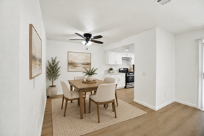 Upland apartment for rent - Dining area with wood table and ceiling fan at Coventry Square Apartments, California