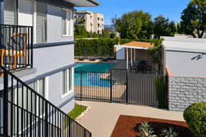 Van Nuys apartment for rent - A small pool in a backyard surrounded by a black fence.
