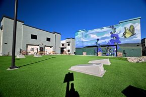 Camp Verde apartment for rent - A person is holding a shadow of a person in front of a building.