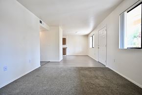 Mesa apartment for rent - A spacious room with a carpeted floor and white walls.