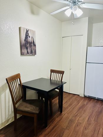Small table with two chairs in a room