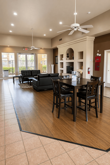Chandler apartment for rent - A modern living room with a black sofa set and a dining table with chairs.