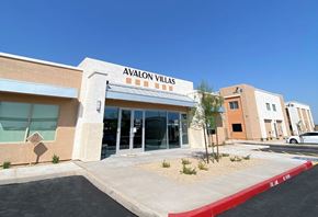 Phoenix apartment for rent - Avalon Villas is a building with a red and white striped awning.