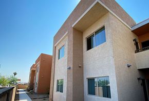 Phoenix apartment for rent - A modern house with a flat roof and a balcony.