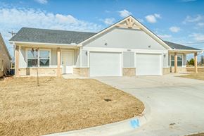 Oklahoma City triplex for rent - A two-car garage with a white door is visible.