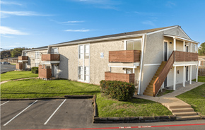 Wichita Falls apartment for rent - A building with a parking lot in front of it.