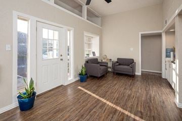 Wichita Falls apartment for rent - a living room with two chairs and a door