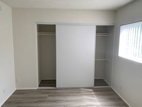 North Hills apartment for rent - an empty bedroom with a closet and a window