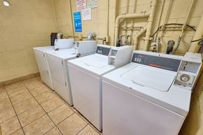 Los Angeles apartment for rent - A row of washing machines in a laundromat.