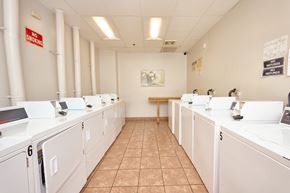 Los Angeles apartment for rent - A laundromat with a "No Smoking" sign on the wall.