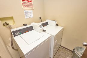 Los Angeles apartment for rent - A washing machine and dryer in a small room.