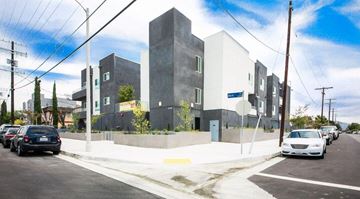 North Hollywood apartment for rent - a city street with cars parked in front of a building