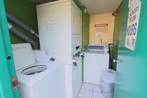 Los Angeles apartment for rent - A small laundry room with a washer and dryer.