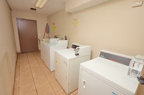 Los Angeles apartment for rent - A clean, empty room with a washing machine and dryer.