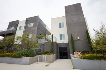 North Hollywood apartment for rent - A modern house with a black and white exterior is for sale.