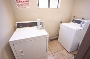 Los Angeles apartment for rent - A laundry room with a washer and dryer.