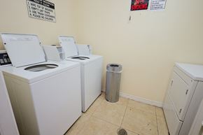 Los Angeles apartment for rent - A laundromat with washers and dryers and a sign that says No Smoking.