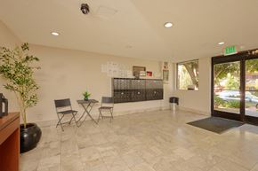 Los Angeles apartment for rent - A room with a potted plant, chairs, and a table.