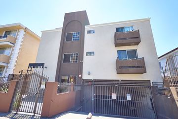 Los Angeles apartment for rent - A building with a brown gate in front of it.