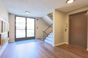 Los Angeles apartment for rent - A room with a staircase and a door.