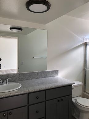 Los Angeles apartment for rent - a bathroom with a sink and a toilet and a mirror