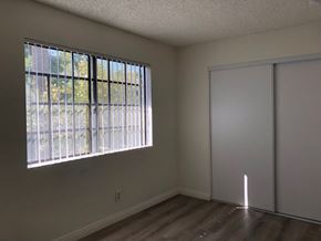 Los Angeles apartment for rent - an empty living room with a large window and a closet