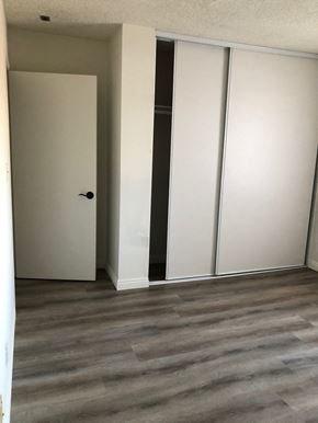 Los Angeles apartment for rent - a living room with white walls and a wood floor