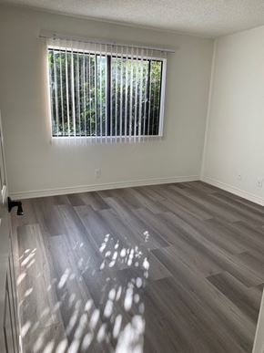 Los Angeles apartment for rent - an empty room with wood floors and a window