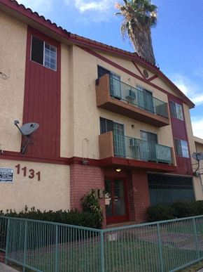 Los Angeles apartment for rent - a building with a balcony and a palm tree
