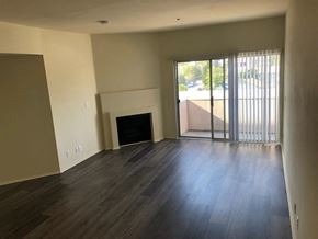 Los Angeles apartment for rent - a living room with wood floors and a fireplace
