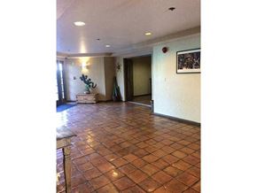 Los Angeles apartment for rent - a living room with a tiled floor and a door