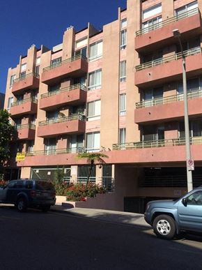 Los Angeles apartment for rent - an apartment building with cars parked in front of it