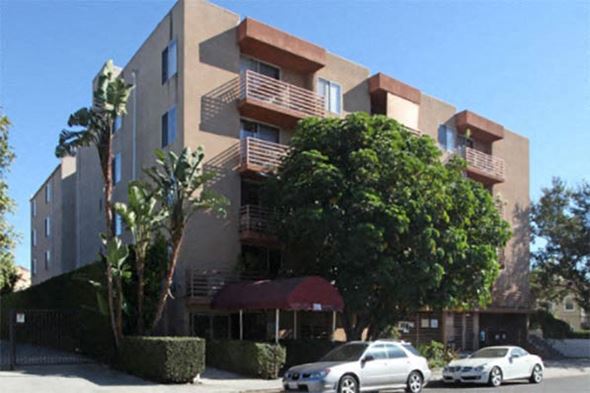 Los Angeles apartment for rent - an apartment building with cars parked in front of it
