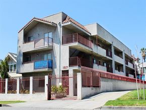 Los Angeles apartment for rent - an apartment building with balconies and a sidewalk