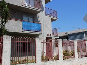 Los Angeles apartment for rent - an apartment building with a fence and a gate